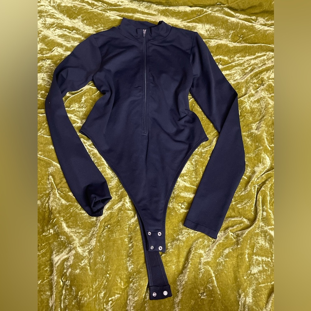 Garage form fitting black zipper front turtleneck bodysuit sleeve top